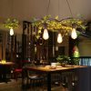 Bitkili çember sarkıt avize modeli, siyah metal yeşil yapraklı kafe ve restoran salonu aydınlatması