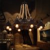 Konik şapkalı halat avize modeli, siyah metal 8 kollu jüt askılı kafe ve loft salon aydınlatması